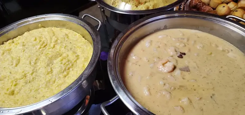 Pans of creamy soup on a serving line