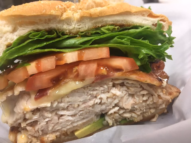 Turkey sandwich with lettuce, tomato and avocado